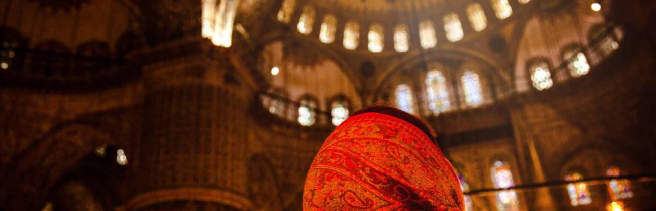 Woman praying inside a mosque