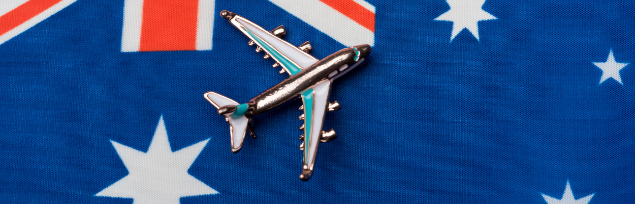 Image of an Australian flag with a small toy plane sitting on top 